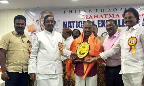 AP Official Language Commission president P Vijayababu and State Media Academy president Kommineni Srinivas presenting Gandhiji Sadbhavana Award to environmentalist Chilukuri Srinivasa Rao at a programme in Vijayawada on Monday