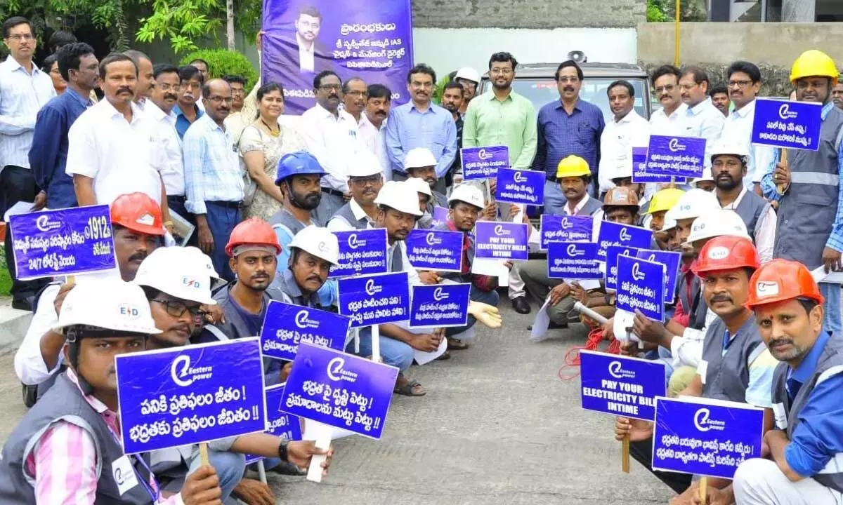 APEPDCL employees take out a rally from the corporate office holding placards on safety in Visakhapatnam