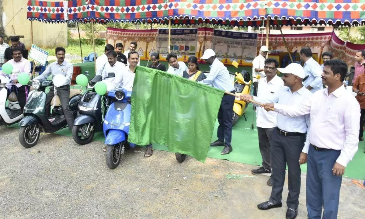 NTR district collector S Dilli Rao flagging-off the e-bikes in Vijayawada on Tuesday
