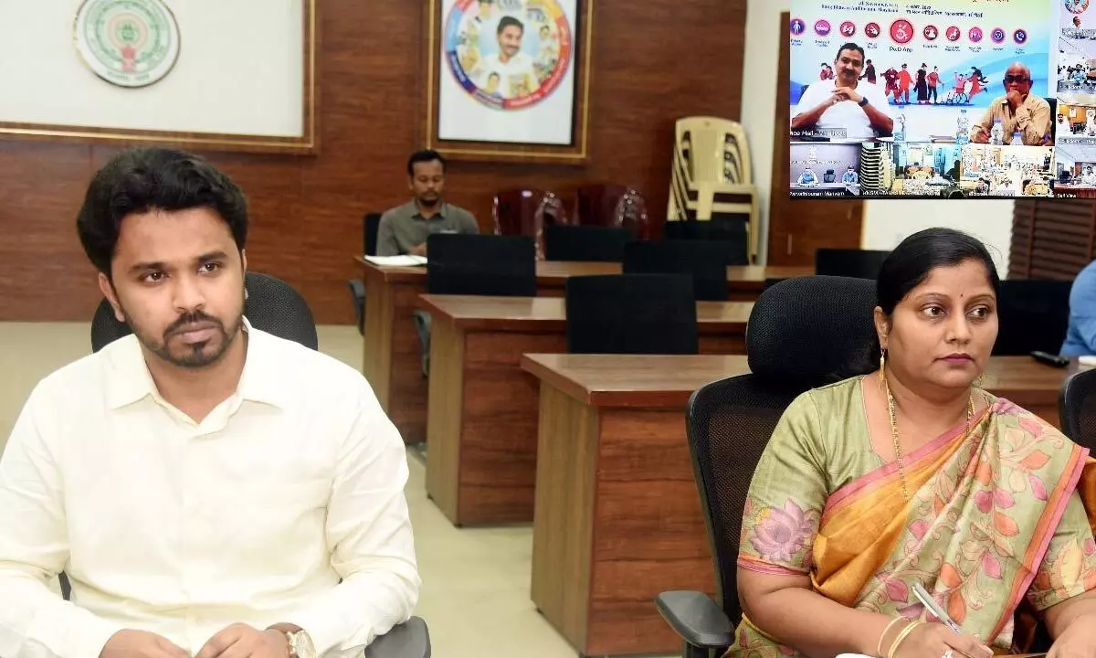 Eluru district collector V Prasanna Venkatesh participating in a  video conference from his office in Eluru on Tuesday