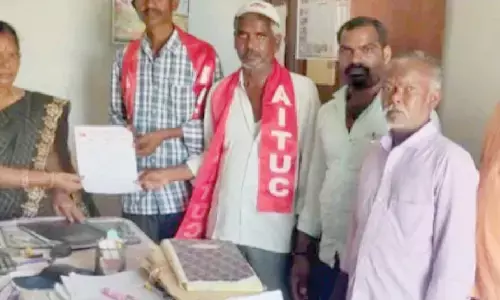 CITU leaders handing over a representation to the officer of Labour department in Yemmiganur  on Tuesday