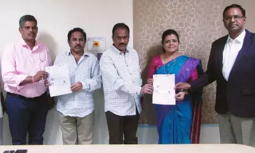 Representatives of St Ann’s College and Care Yoga Naturopathic Medical College exchanging copies of MoU