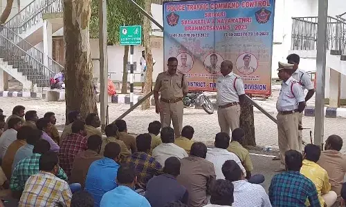 Traffic DSP Kondaiah conducting an awareness meeting for private transport operators over traffic violations in Tirumala on Saturday