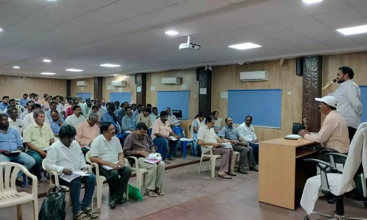 State Housing Corporation Chief Engineer GV Prasad speaking at a meeting at Collectorate in Rajamahendravaram on Tuesday