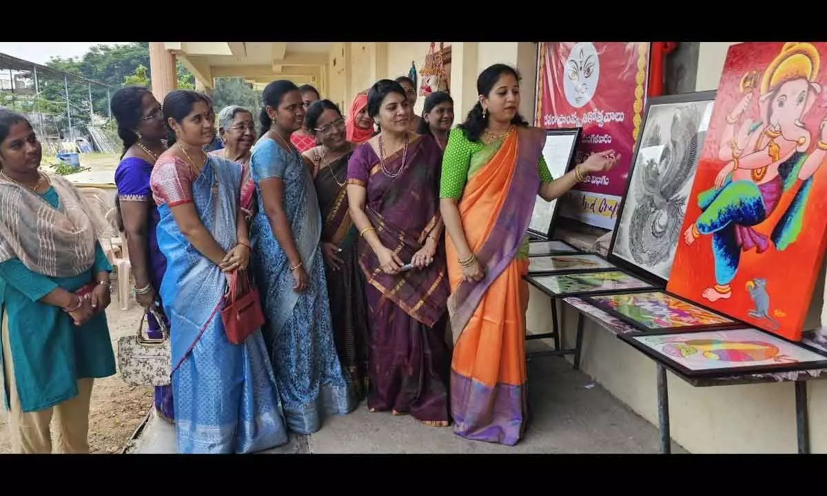 Visitors looking at crafts in Art and Craft exhibition organised in Vijayawada on Tuesday