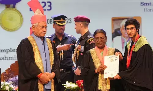 President Droupadi Murmu presents degree to a student during the 20th convocation of Kashmir University, in Srinagar on Wednesday. Jammu and Kashmir Lt Governor Manoj Sinha is also seen