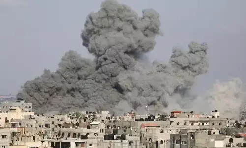 Palestinians rush to buy food and struggle under strikes as Israel readies possible ground operation