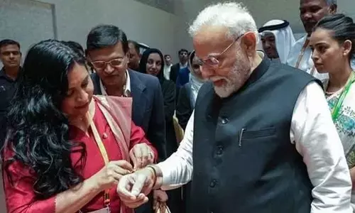 President of Senate Mexico Ana Lilia Rivera Rivera ties a Rakhi on Prime Minister Narendra Modis hand, on the sidelines of the P20 Summit