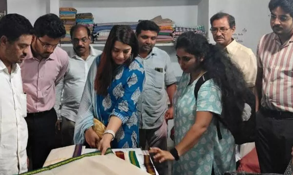 Central government’s Invest India team members inspecting handloom cloths making by weavers at Ponduru