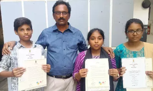 Trividha School students with school chairman Sabbineni Srinivas