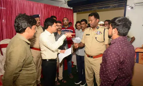 District collector A Mallikarjuna along with Police Commissioner A Ravi Shankar examining EVM godown in Visakhapatnam on Sunday