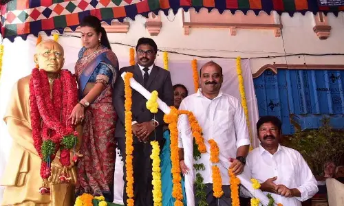 Minister RK Roja garlanding the statue of Kuchipudi dance Guru Vempati Chinna Satyam in Movva on Sunday