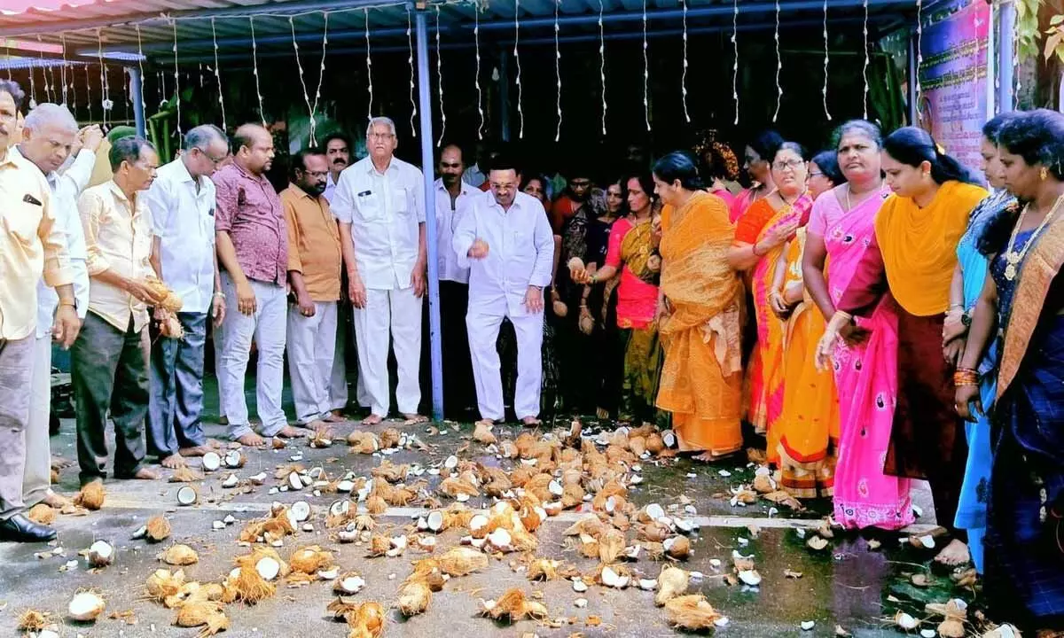 TDP leaders and activists breaking coconuts at a temple, wishing recovery of their national president N Chandrababu Naidu, in Rajamahendravaram on Monday