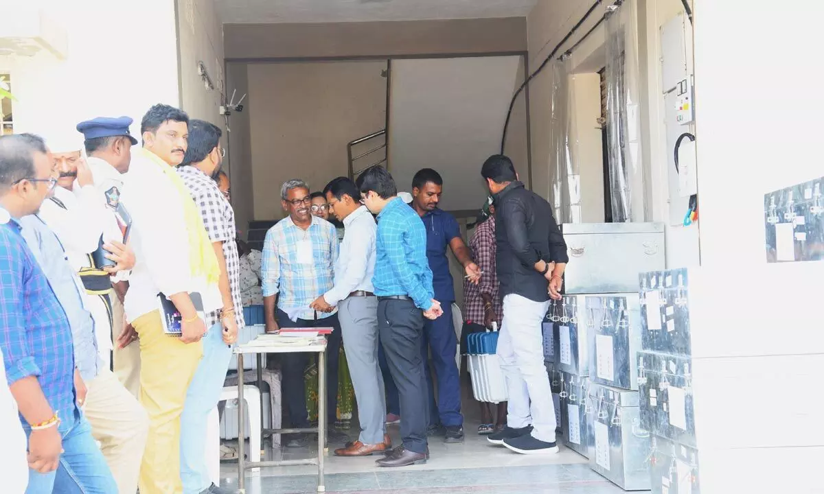 Collector AS Dinesh Kumar interacting with officials on FLC of EVMs at EVMs godown in Ongole on Tuesday