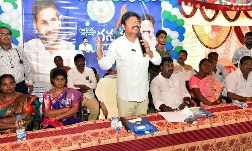 Minister for Housing Jogi Ramesh explaining the importance of Arogya Suraksha at Bantumilli on Tuesday