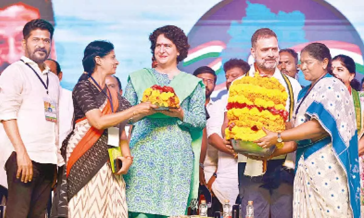 Congress leaders Rahul Gandhi and Priyanka Gandhi Vadra receiving Bathukammas at the Vijayabheri Yatra in Mulugu on Wednesday.