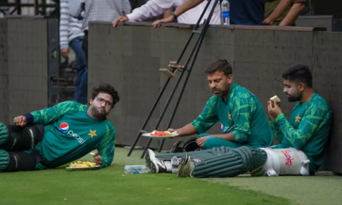 Pakistans captain Babar Azam with teammate Imam-ul-Haq during  a practice session at M. Chinnaswamy Stadium in Bengaluru on Wednesday