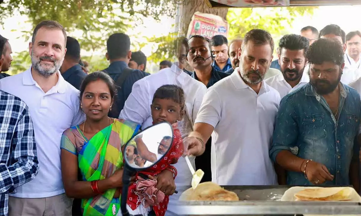 Rahul Gandhi gifts  chocolate to kids and makes dosas during Telangana visit