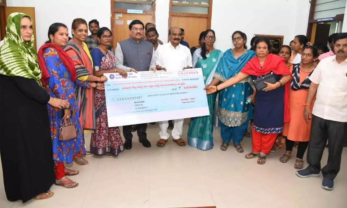 Chittoor MP N Reddeppa, Joint Collector P Srinivasulu and others distributing a cheque of Jagananna Chedodu scheme at the Collectorate in Chittoor on Thursday