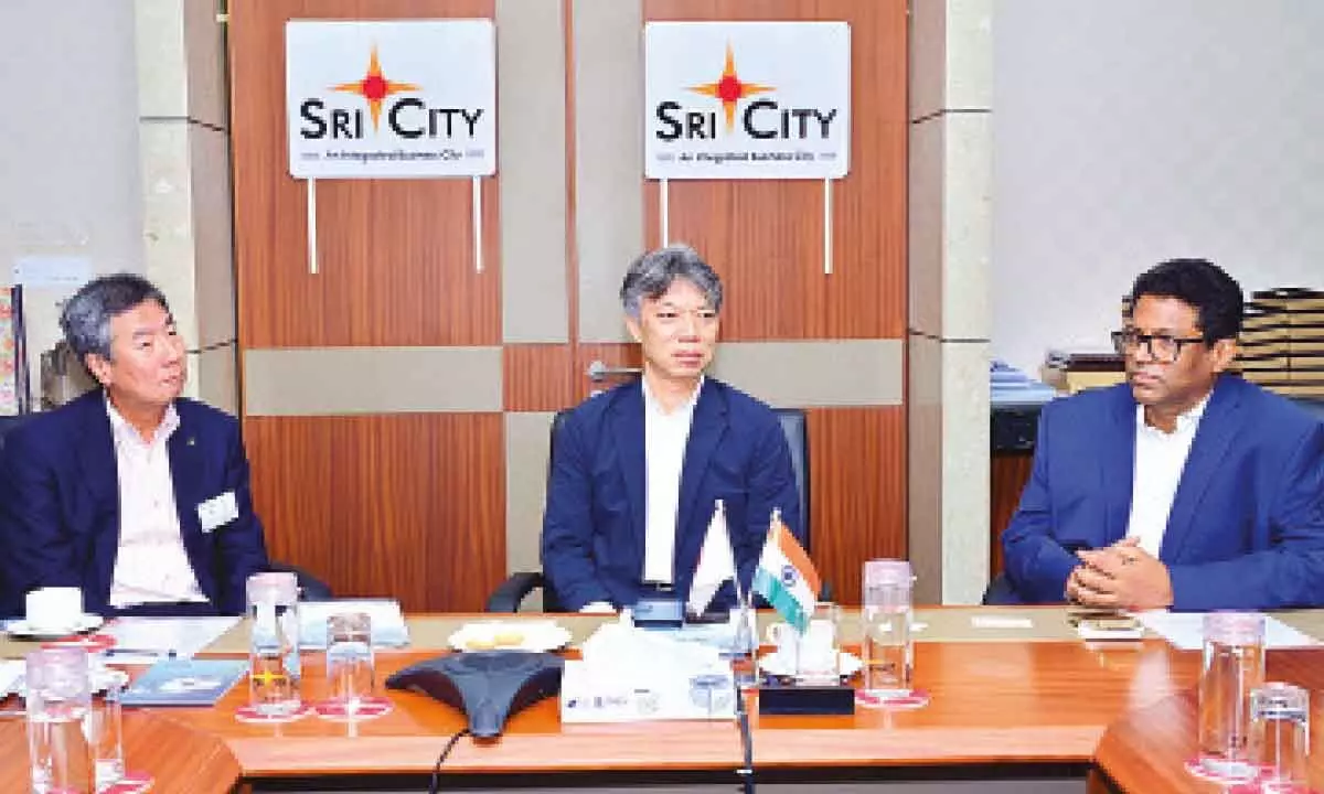 Japanese delegation members Tomita Minoru and Murahashi Yasuyuki and Sri City MD Ravindra Sannareddy at a meeting in Tirupati on Thursday