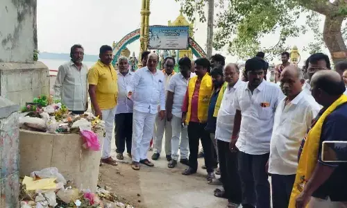 MLA Gorantla Butchaiah Chowdary with staff at the  Ramapadala Revu bathing ghat in Dowleswaram on Thursday