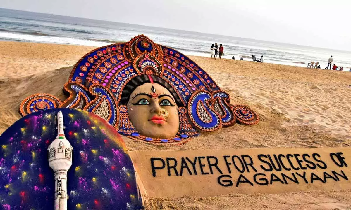 Sand sculpture of Goddess Durga with Prayer for Success of Gaganyaan, created by the sand artist Sudarsan Pattnaik, at Puri Beach on Friday