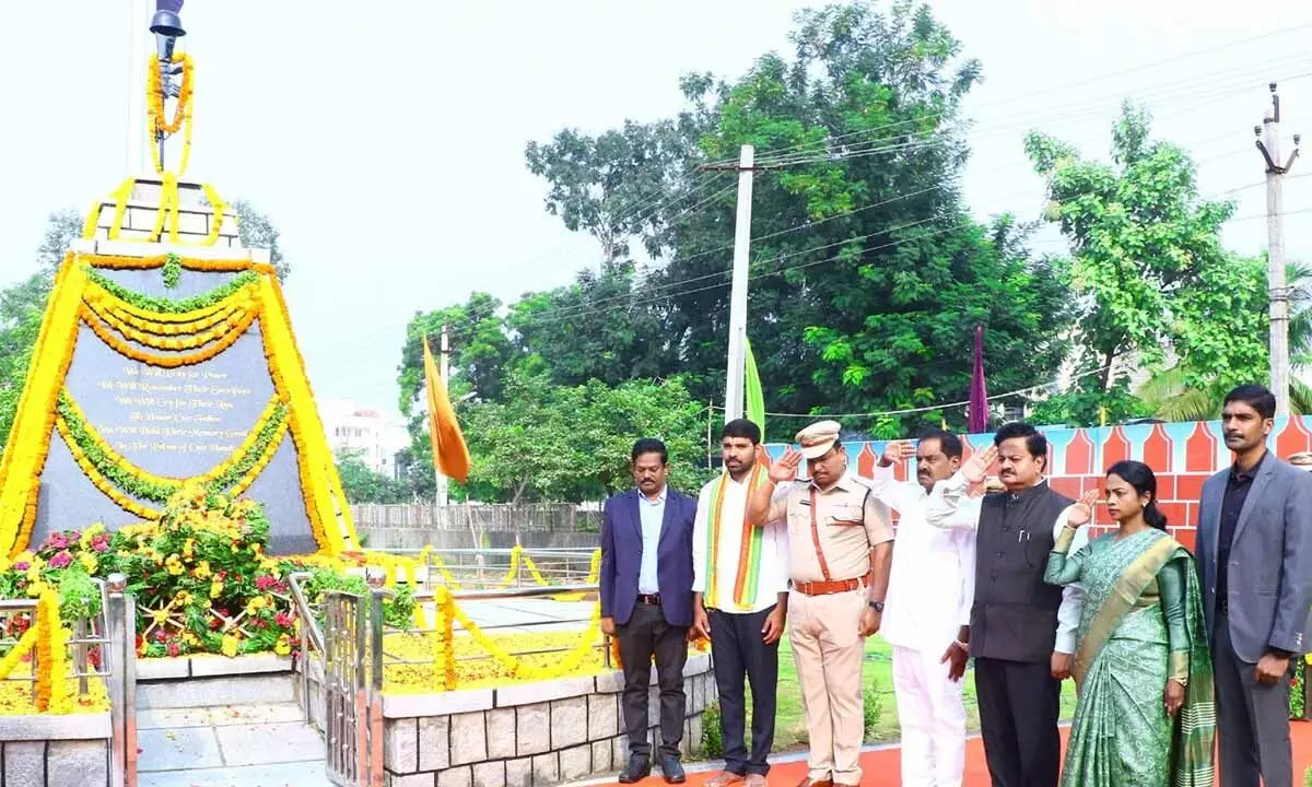 Deputy Chief Minister K Narayana Swamy, Tirupati Collector Venkataramana Reddy, SP Parameswar Reddy and Corporation Commissioner salute martyrs at the Police Memorial in Tirupati on Saturday on the occasion of Police Commemoration Day