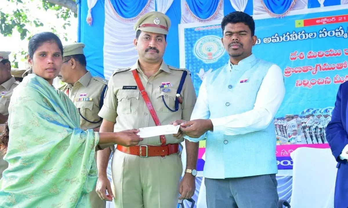 Sri Sathya Sai District Collector P Arun Babu and SP S V Madhav Reddy taking part in a programme organised in connection with the Police Commemoration Day in Puttaparthi on Saturday