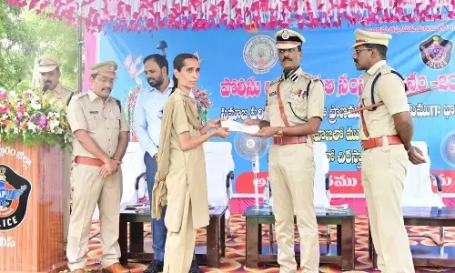 DIG R N Ammireddy felicitating family members of police personnel in Anantapur on Saturday. SP KKN Anburajan is also seen.