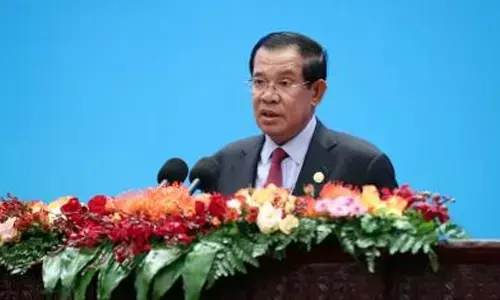 Cambodias ruling party forms coalition with 27 other parties