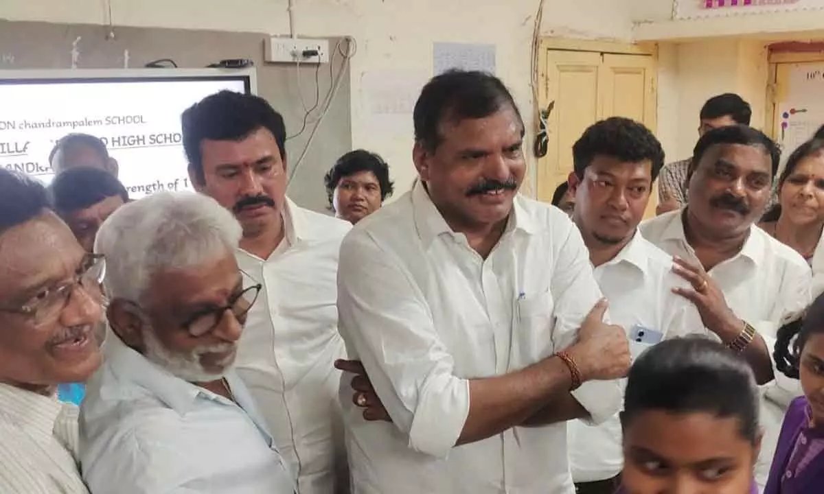 Education minister Botcha Satyanarayana along with other ministers and leaders interacting with Chandrampalem ZP high school students in Visakhapatnam on Saturday