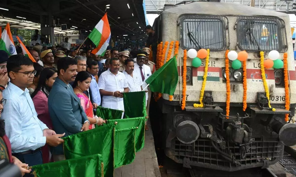 NTR district collector S Dilli Rao flagging off Amrit Kalash Yatra special train from Vijayawada Railway Station on Saturday