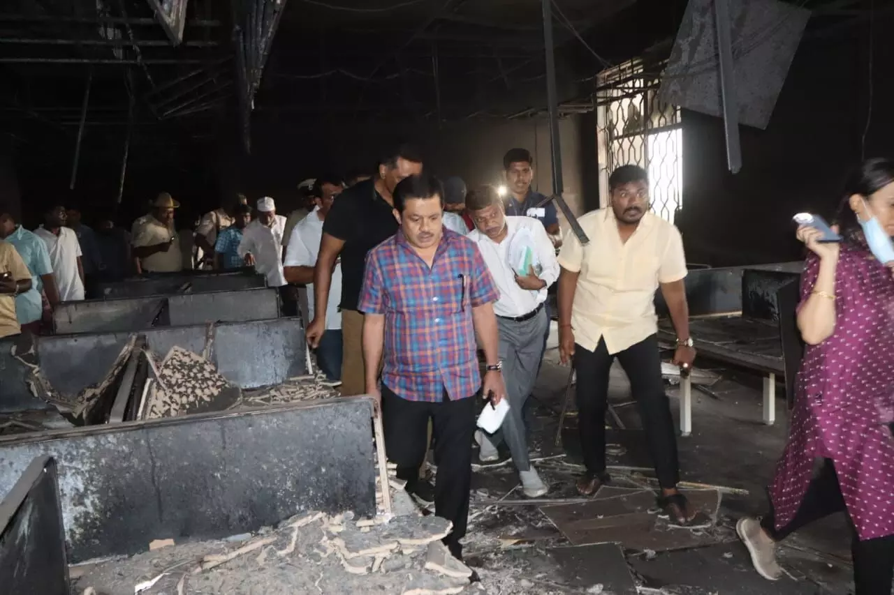 Minister Zameer Ahmed visits Haj Bhavan to see the extent of damage due to fire