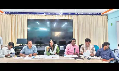 Municipal  Commissioner  J Aruna speaking at a review meeting at municipal corporation conference hall in Chittoor on Sunday