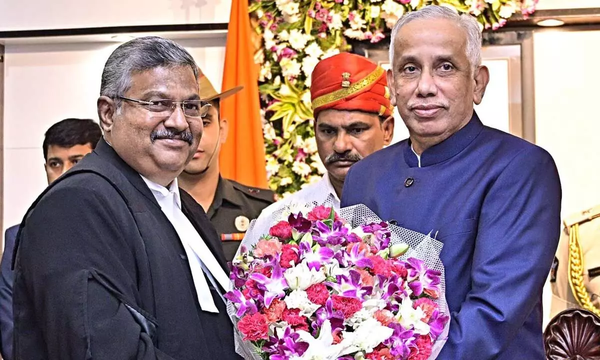 Governor S Abdul Nazeer with Justice Guhanathan Narendar at Raj Bhavan in Vijayawada on Monday