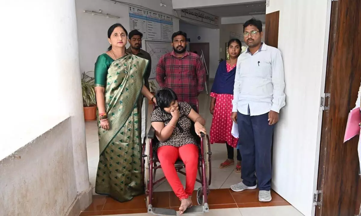 East Godavari district Collector Dr K Madhavi Latha presenting a tricycle to Varshita, a differently abled girl, at the Collectorate in Rajamahendravaram on Monday