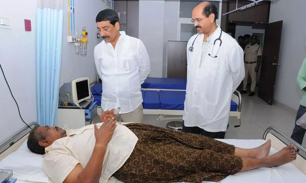 APSRTC Chairman A Mallikarjuna Reddy consoling RTC bus driver Ram Singh at RTC hospital in Vijayawada on Monday