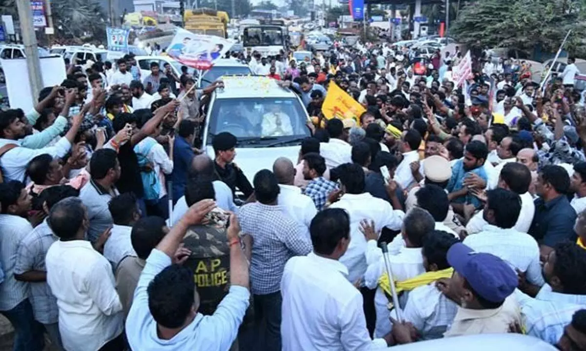 A crowd surrounds TDP national president N Chandrababu Naidu’s vehicle at Rajahmundry Y Junction
