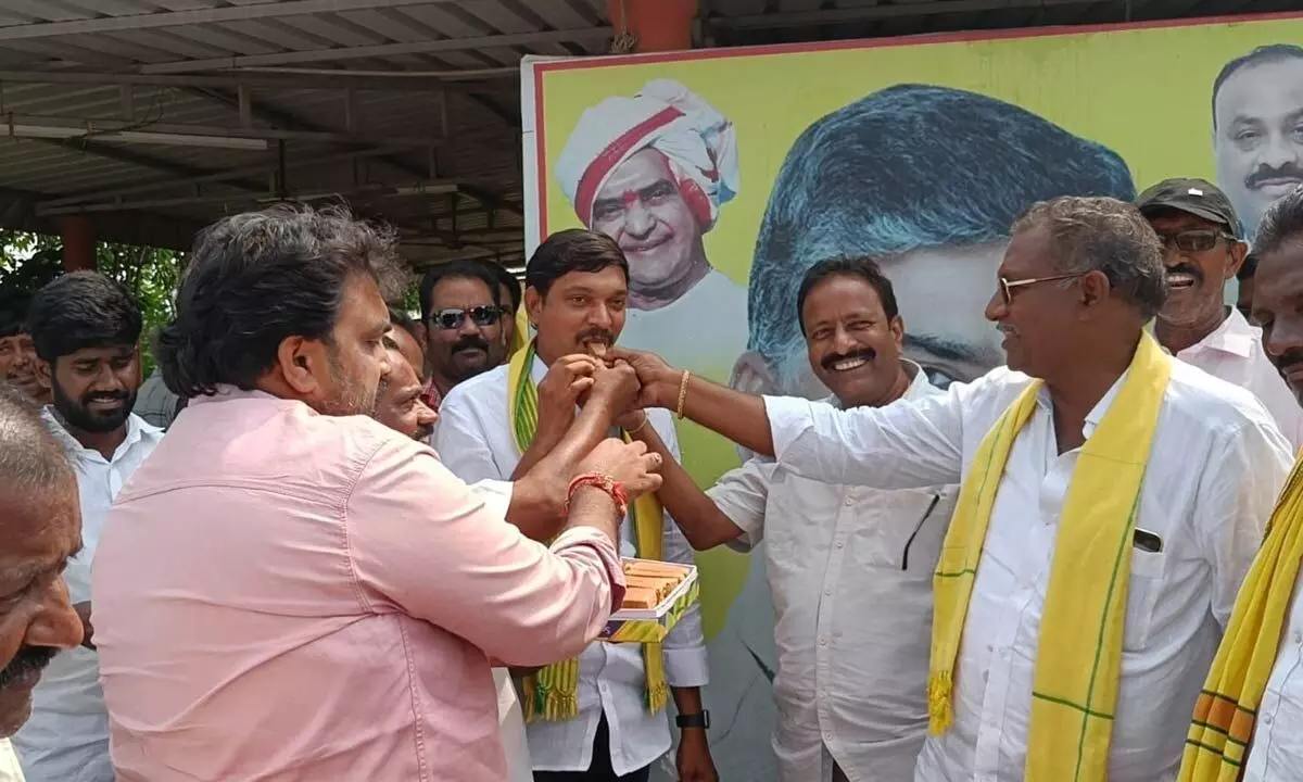TDP leaders celebrating Naidu’s release by distributing sweets in Pedana on Tuesday
