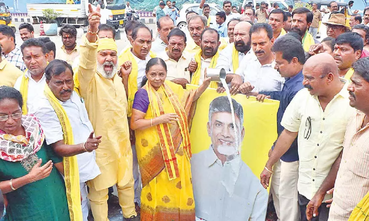 TDP leaders led by former MLA M Sugunamma performing milk bath to the portrait of their chief N Chandrababu Naidu in Tirupati on Tuesday