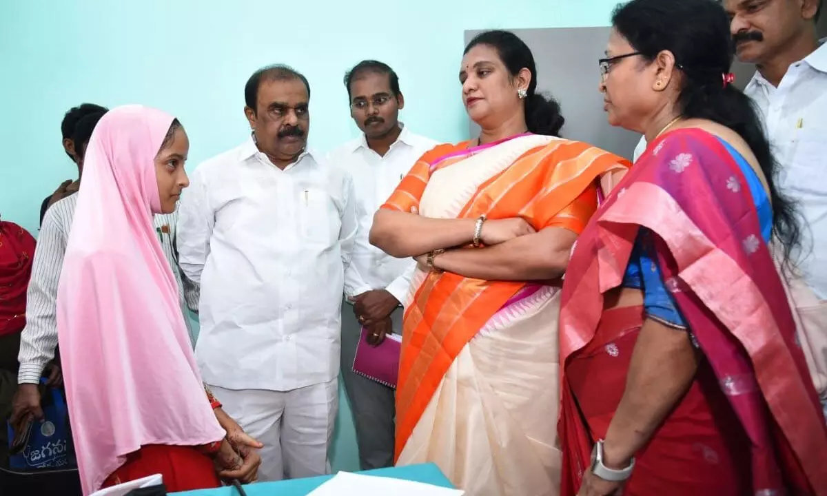 MLA Anantha Venkatarami Reddy and district Collector M Gautami interacting with a patient at Jagananna Aarogya Suraksha camp at Srinivasanagar in Anantapur on Tuesday