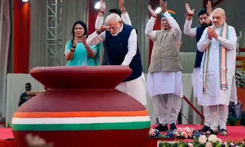 Prime Minister Narendra Modi during an event marking the culmination of the Meri Maati Mera Desh campaign, in New Delhi on Tuesday. Union Ministers Amit Shah, Arjun Ram Meghwal, Meenakashi Lekhi and Nisith Pramanik are also seen