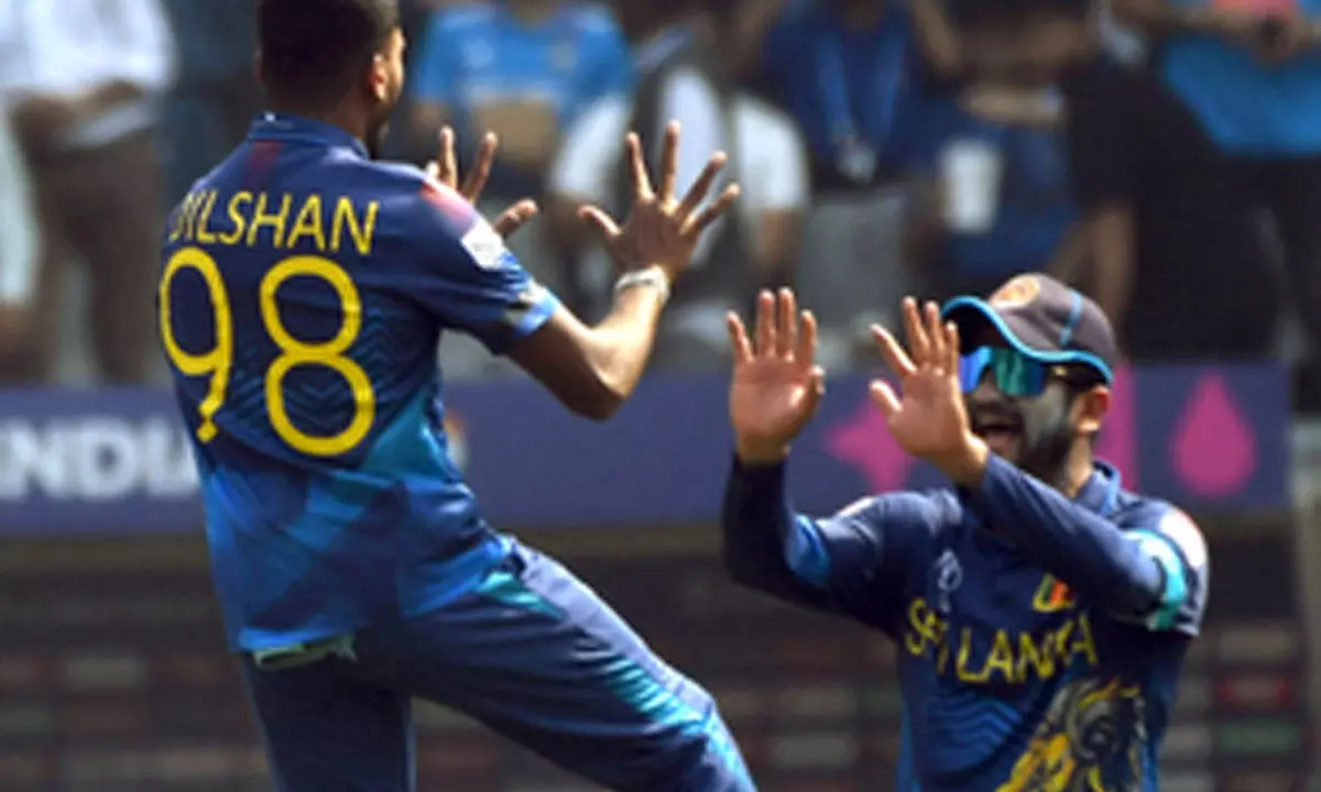 Sri Lanka players wear black-arm bands as a tribute to their renowned fan Abeysekera