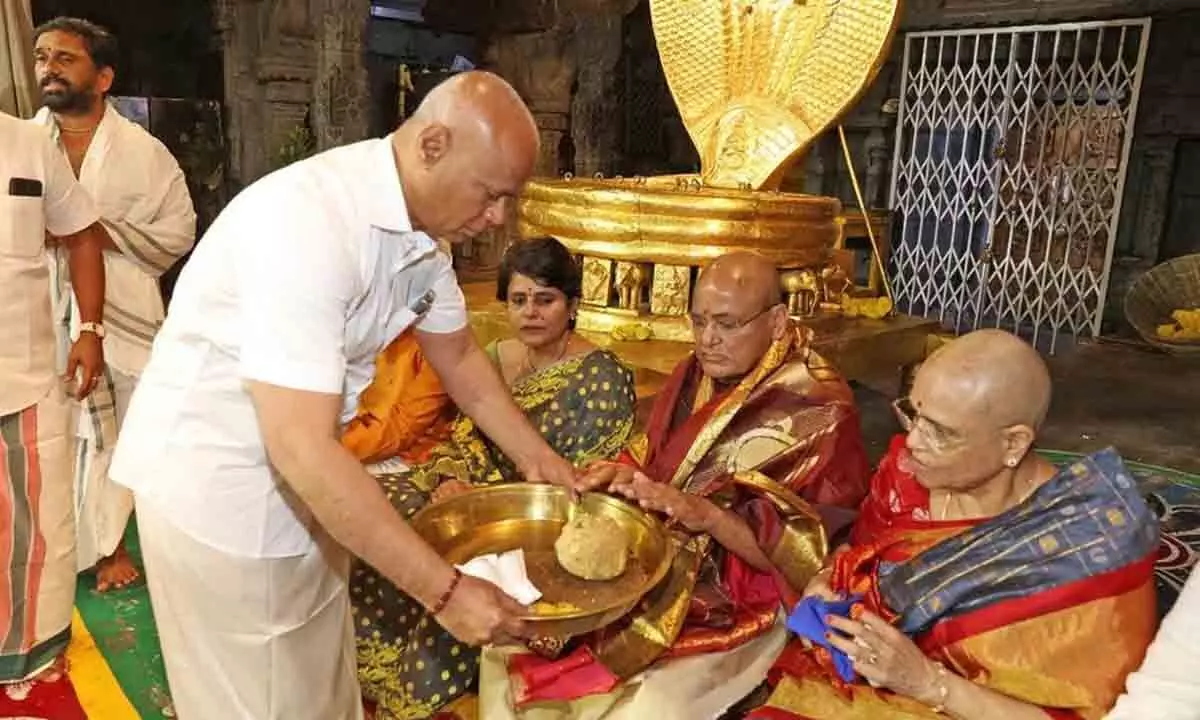 TTD EO A V Dharma Reddy offering theertha prasadams to former Vice President M Venkaiah Naidu, who had darshan in Tirumala temple on Saturday.