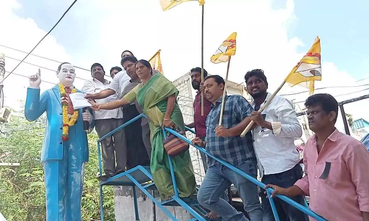 TDP leaders submitting a representation to the state of Dr BR Ambedkar in Vijayawada on Sunday