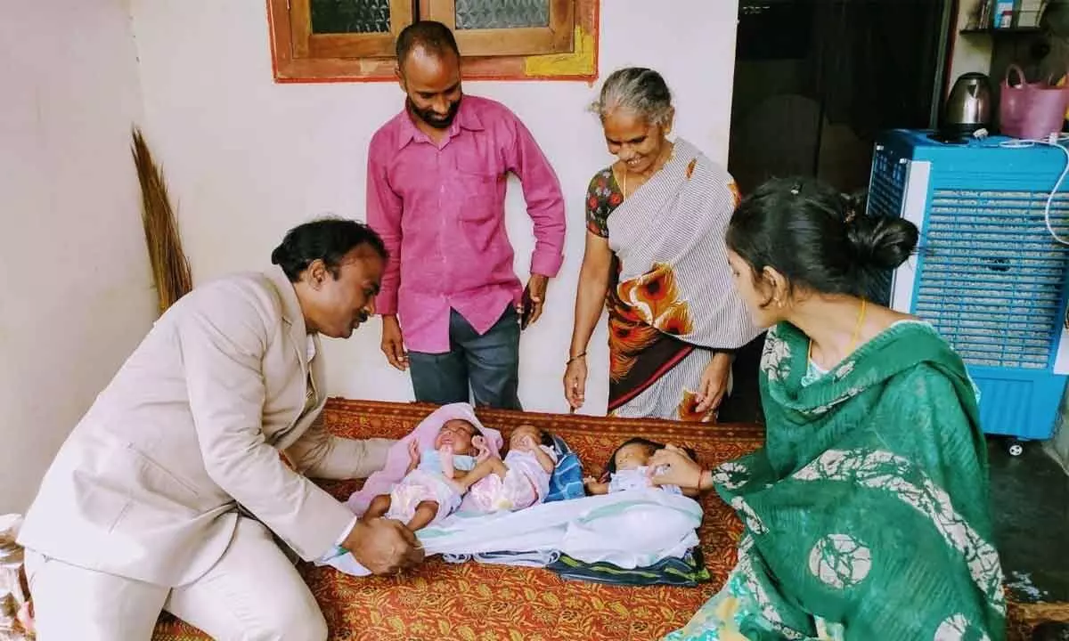 Dr YSR Aarogyasri special officer Dr Yadala Ashok Babu with the babies in Ongole on Saturday