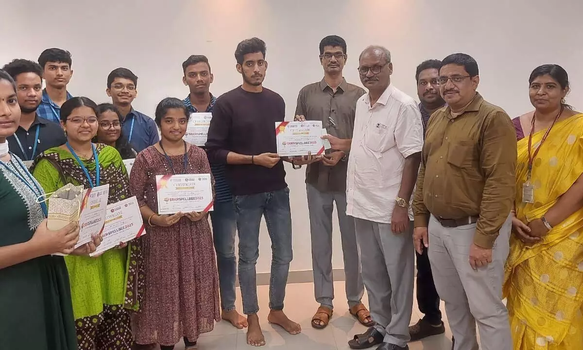 SRKR Engineering College Director Dr M Jagapati Raju giving away prizes to the winners of Spell Bee-2023 competitions on the college premises in Bhimavaram on Monday