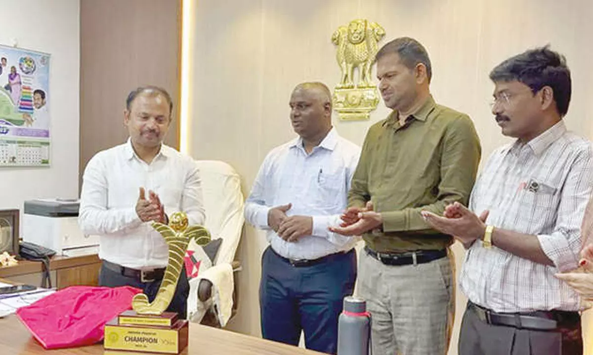 State Project Director of Samagra Shiksha B Srinivasa Rao unveiling Word Power Championship Trophy in Vijayawada on Monday