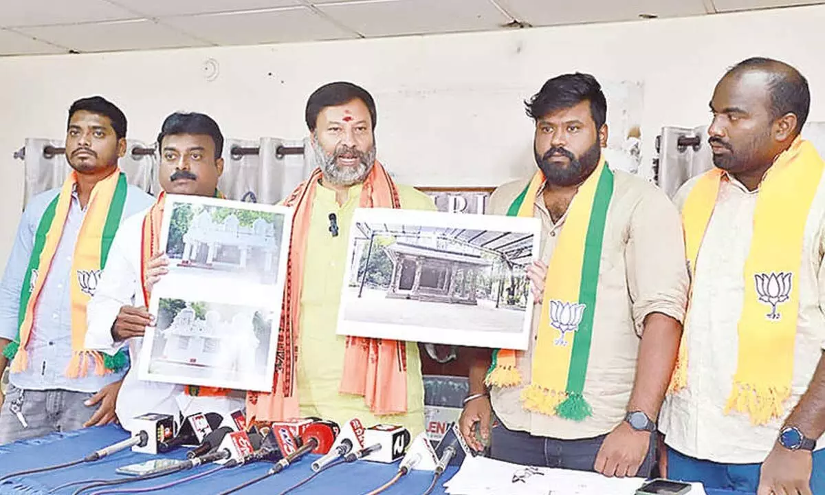 BJP spokesperson G Bhanu Prakash Reddy displaying the photos of old and new Parveta Mandapams before the media in Tirupati on Monday