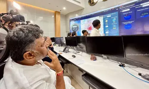 Bengaluru Urban minister visit BBMP war room at midnight as it rains